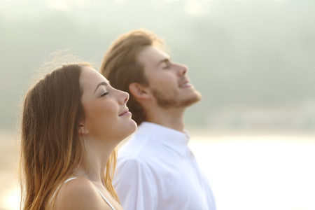 AdobeStock 70594042 450x300 - Couple of man and woman breathing deep fresh air